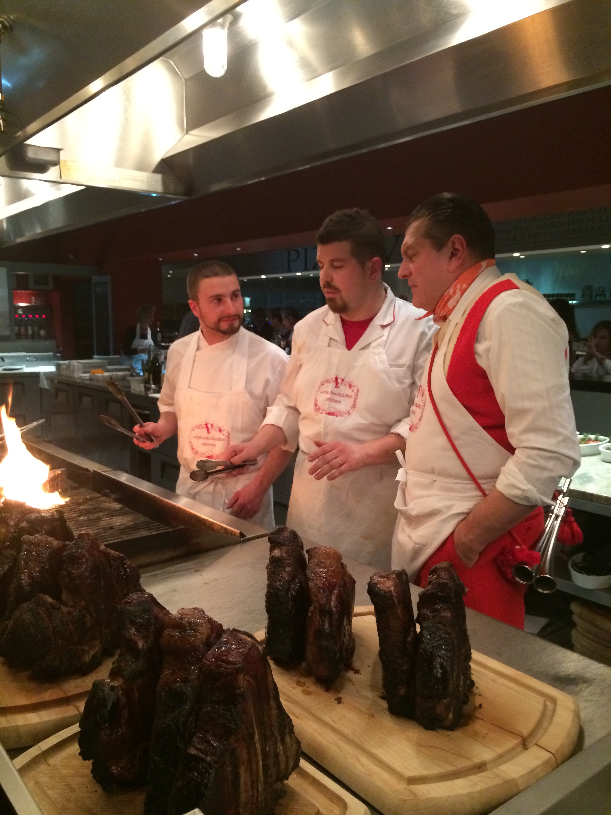 chef Talyor Gant of Mercato West cooking with Dario Cecchini and son-in-law