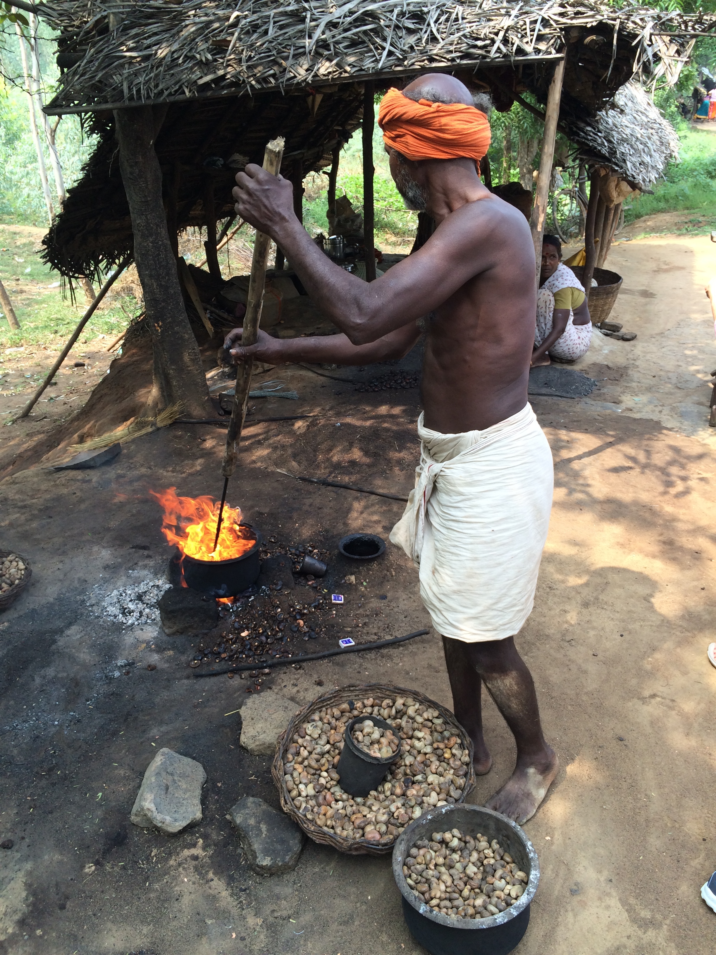 Man roasting cashews - photo credit - Karen Anderson @savouritall