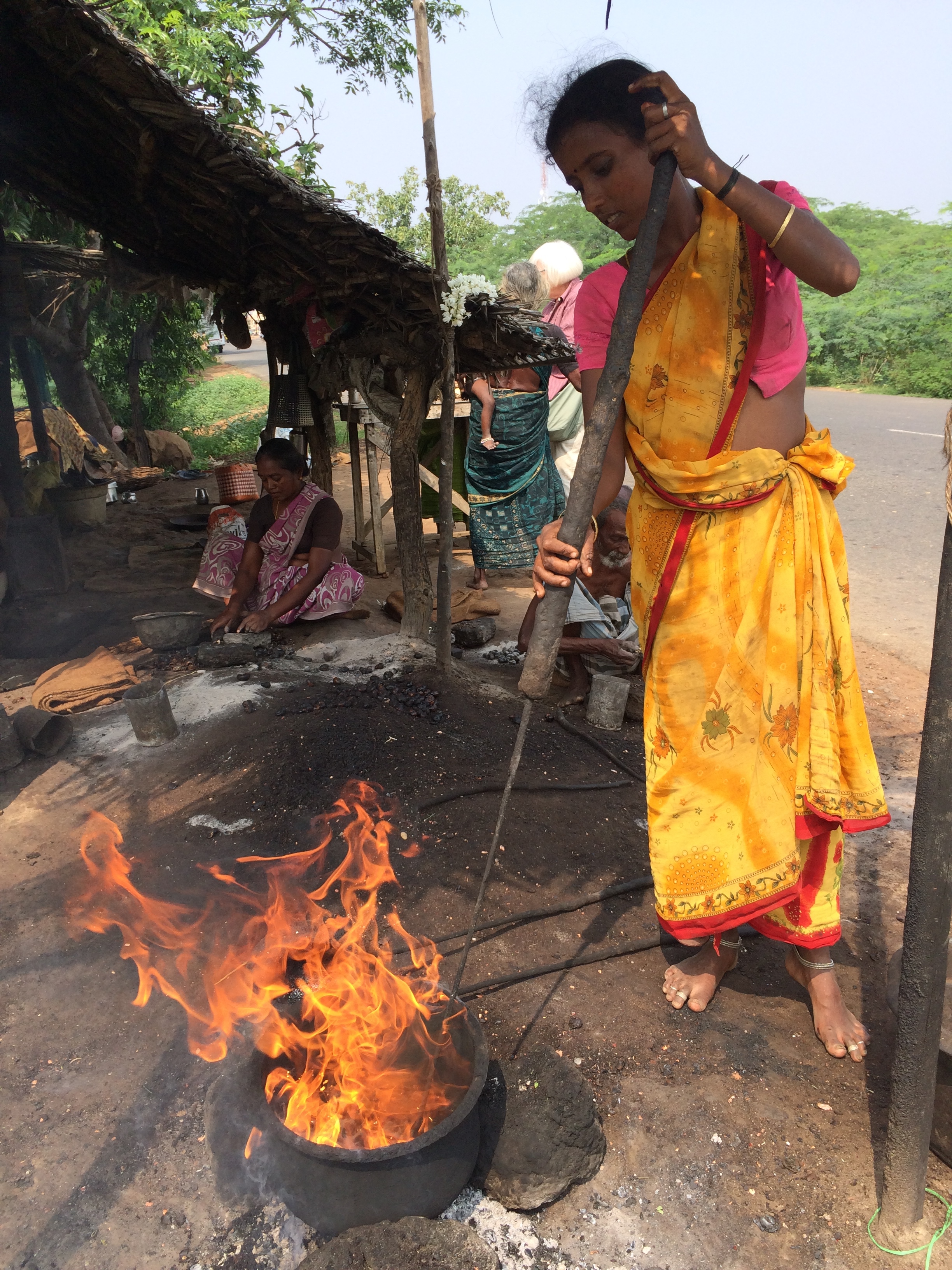 Young woman roasting cashews - photo credit - Karen Anderson @savouritall