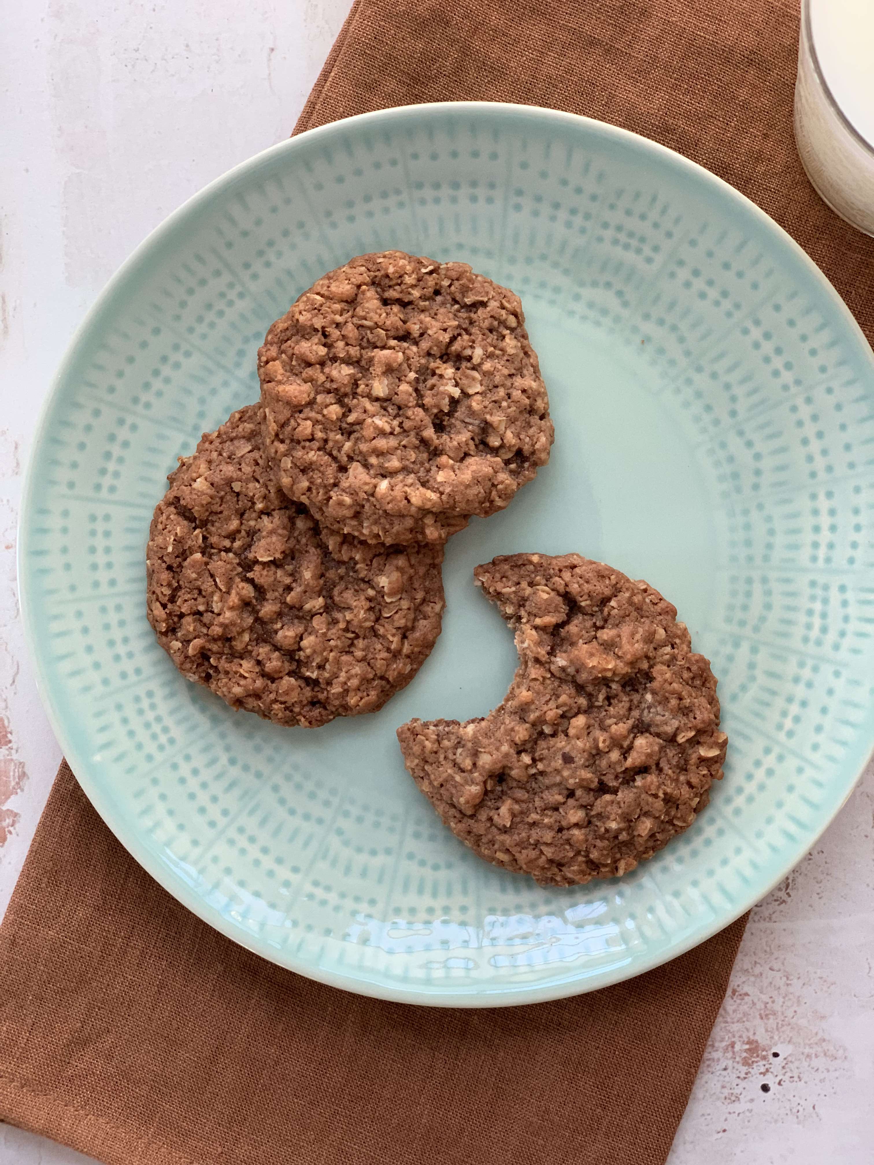 3 chocolate cookies on a green plate