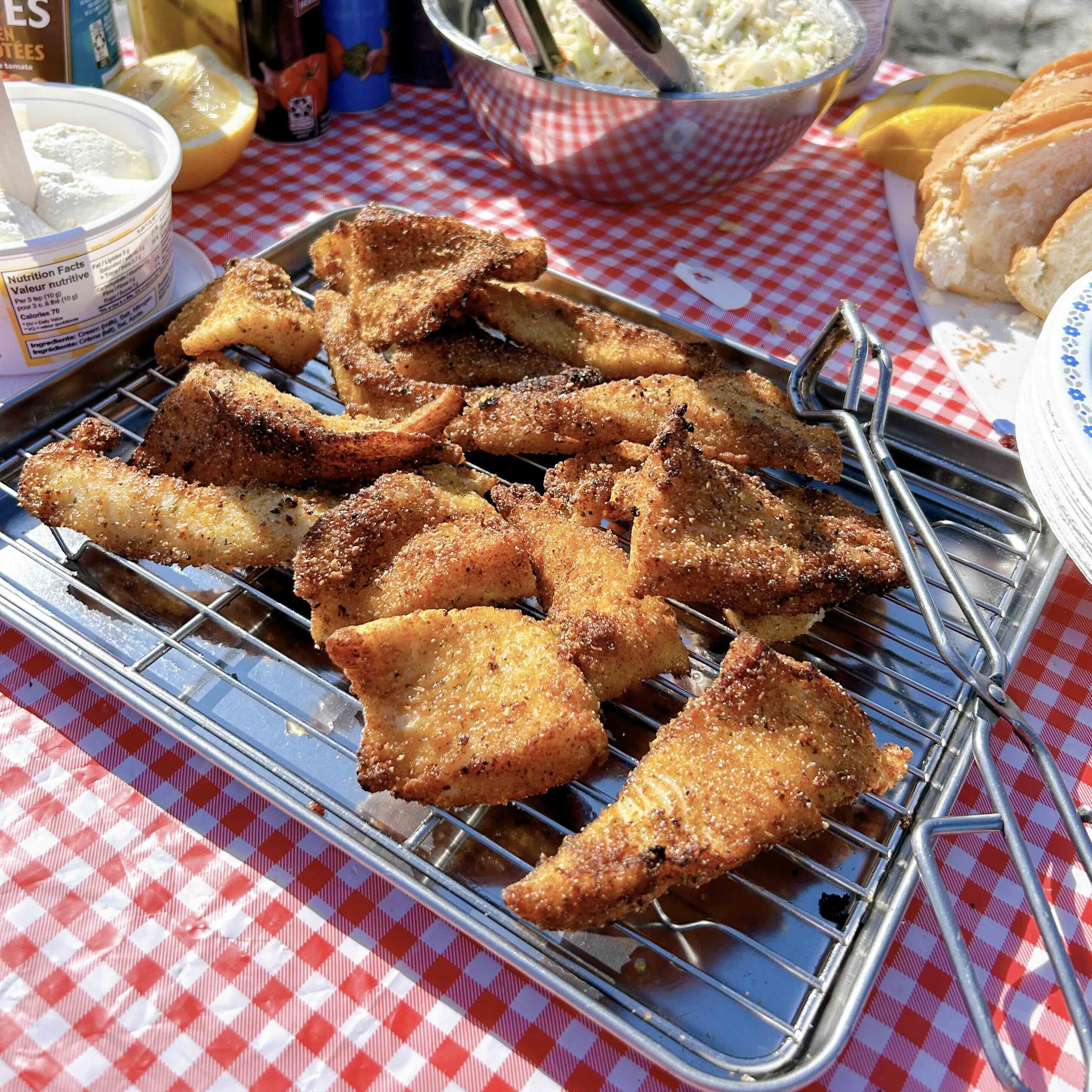 breaded and fried fish on a rack