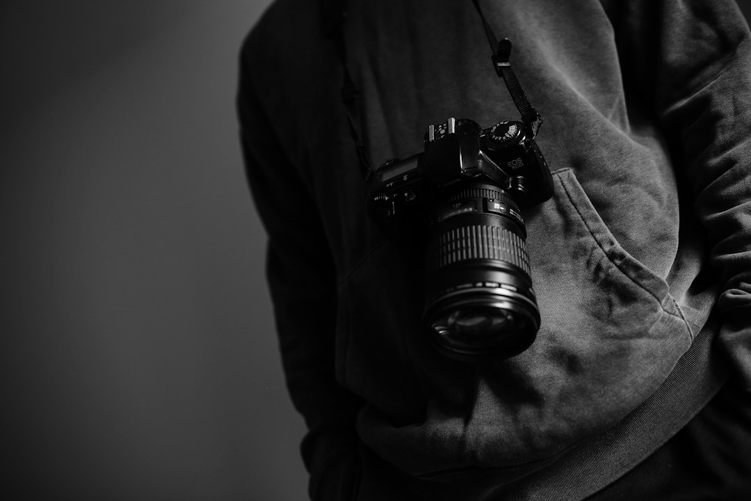 Photographer holding a camera, representing a regular deliberate practice routine