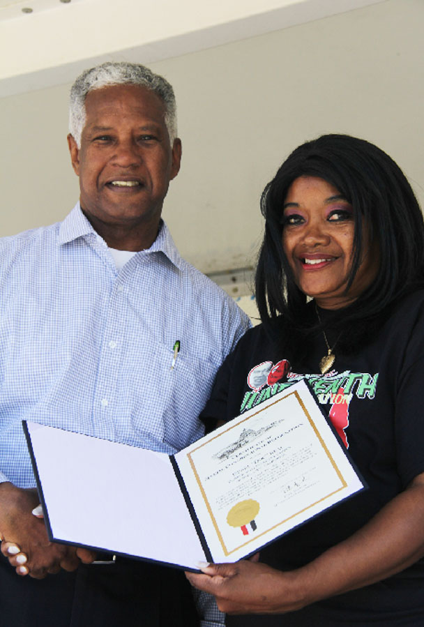 Curt Lewis presented a 'Certificate of Special Congressional Recognition' to the granddaughter of Israel Beal. Credit: John Coleman909 894-3070 Community Photography X (C P Time/s)