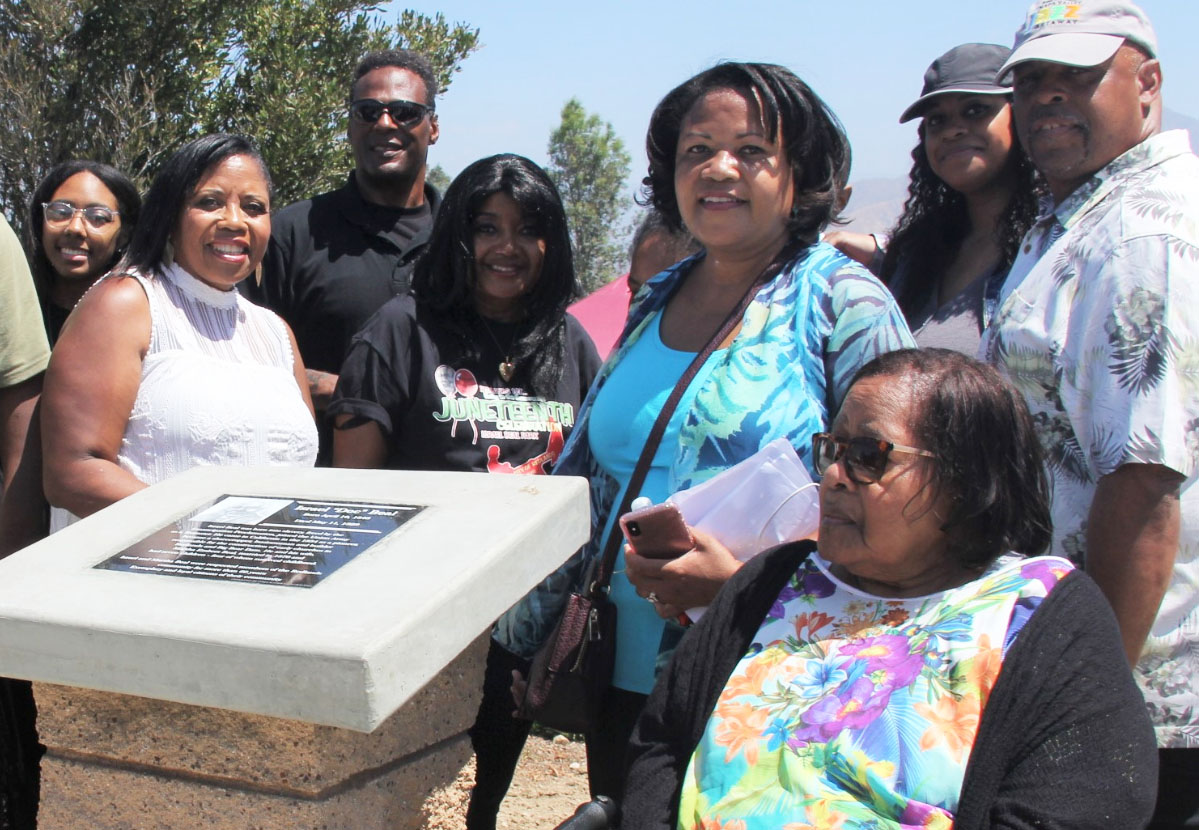 Members of the Israel Beal family gathered around the Israel Beal Memorial. Credit: John Coleman909 894-3070 Community Photography X (C P Time/s)