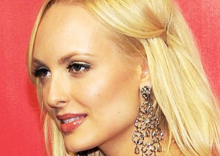 Ex-Playboy model accuses her former lawyer of giving 'unconscionable' hush-money deal to top Trump donor