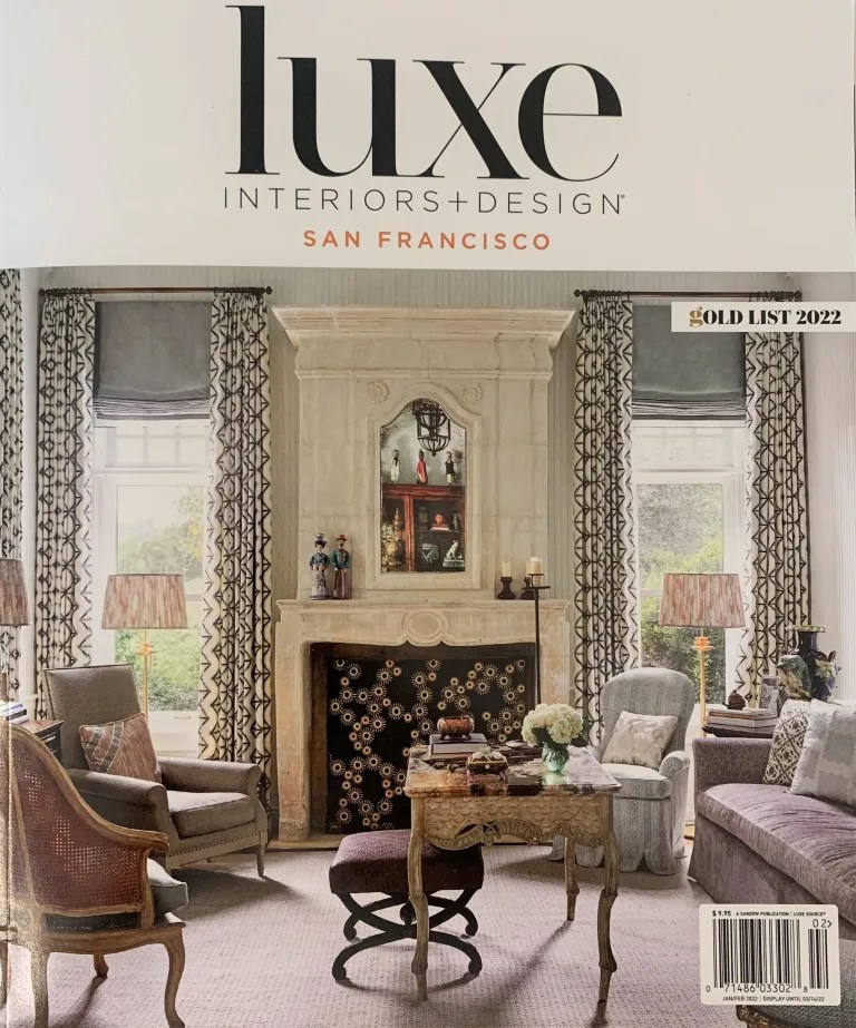 Luxe Interiors + Design magazine cover, featuring an elegant living room with a marble fireplace and traditional furniture in soft tones, San Francisco edition.