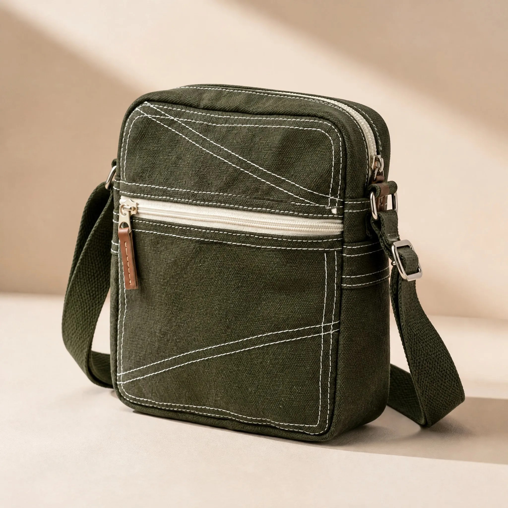Olive green canvas messenger bag side angle view