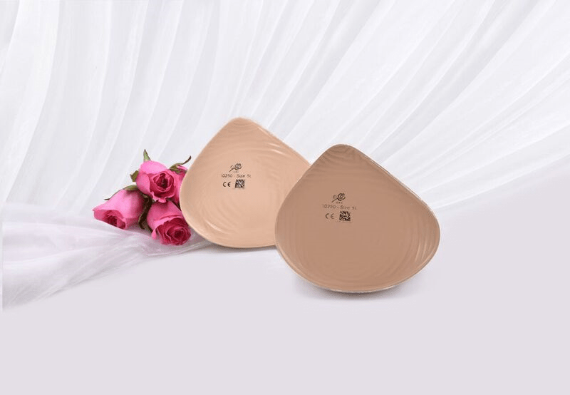 Features an atypical asymmetric footprint with an average profile in the bra cup. It can be positioned to war on either side of the body. Also features an extension that is angled inward to provide medial fullness that minimizes the gap between the bra and the chest wall. The flowable gel back contours to the chest wall for a comfortable fit.