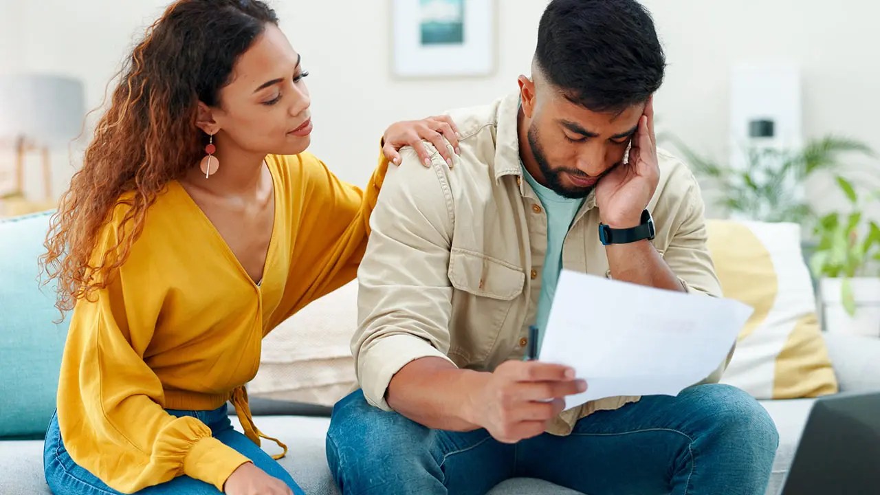 Consultant comforting a client reviewing a deficiency letter.