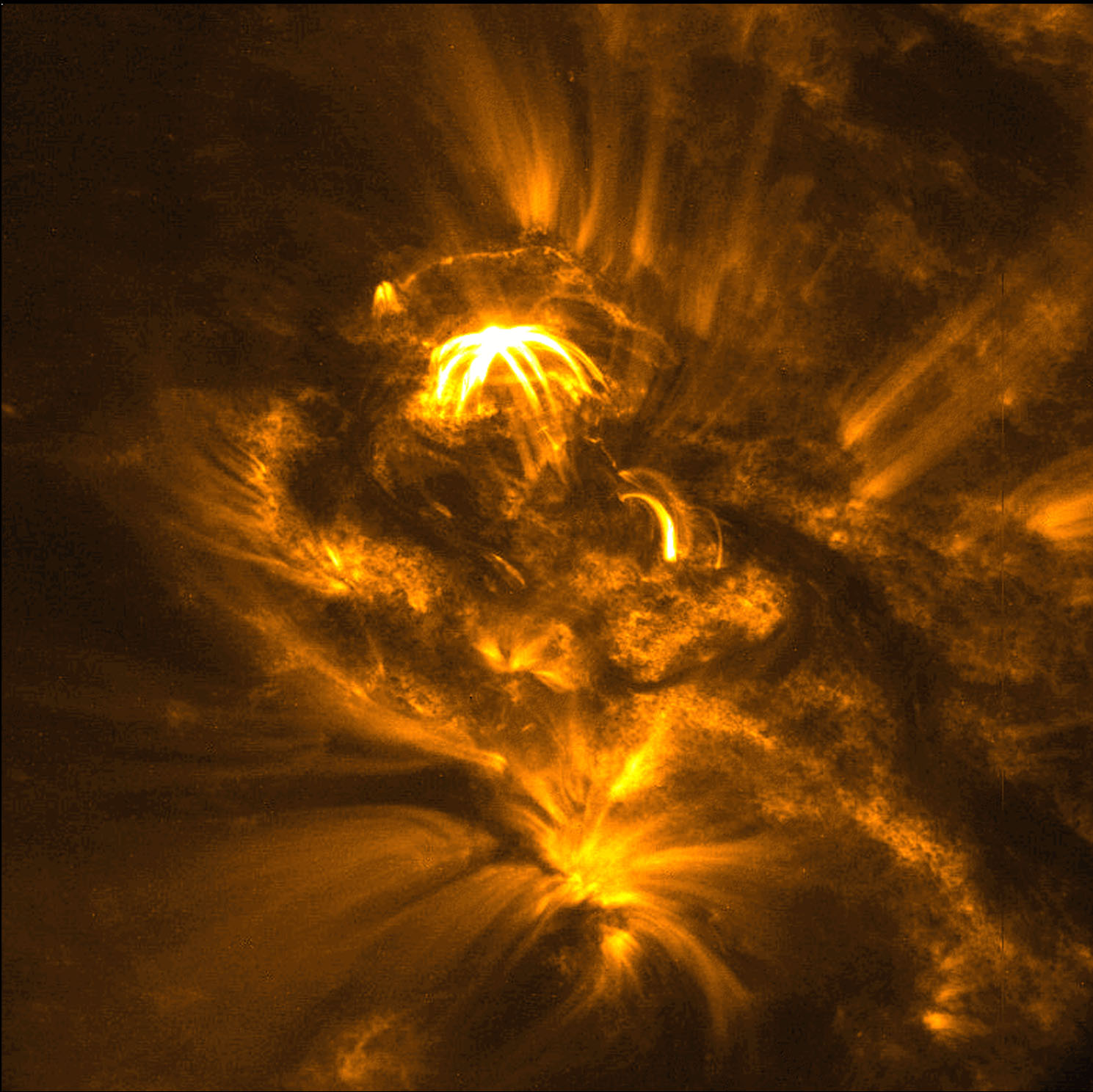 Magnetic loops span active regions on the surface of the Sun. Image by the satellite TRACE.
