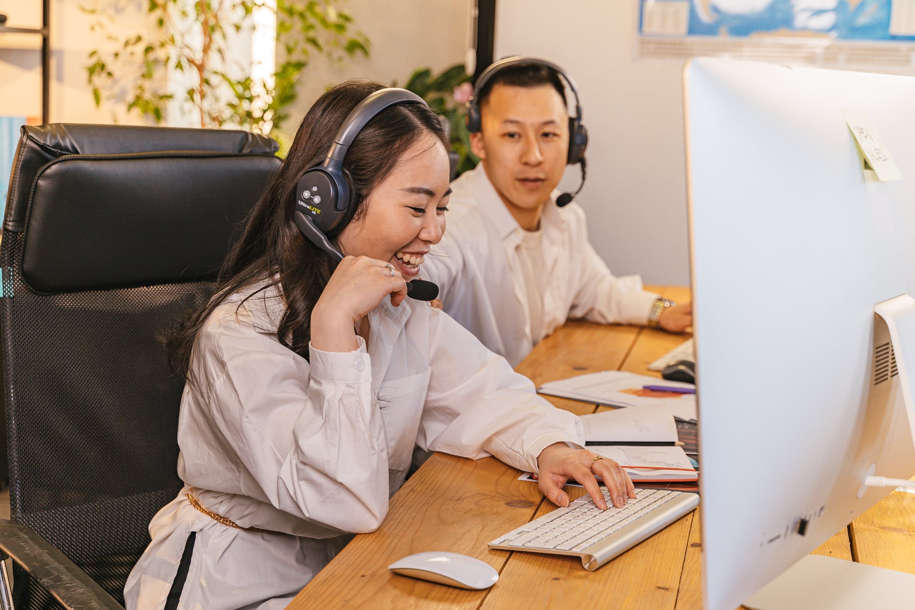 woman and man wearing headphones
