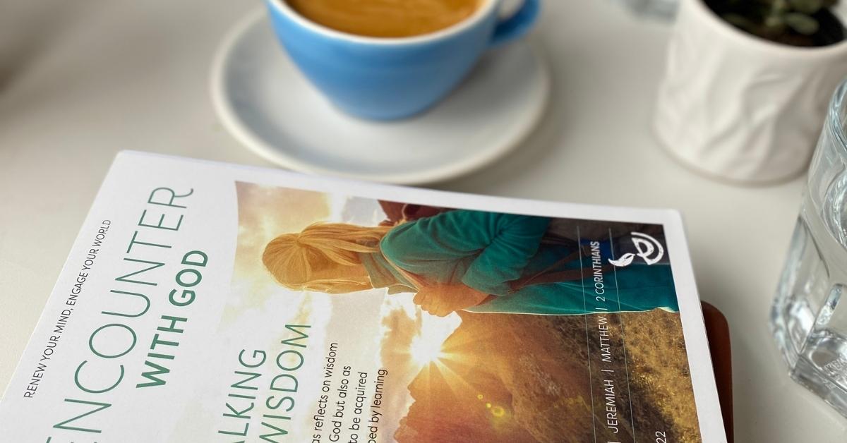 Encounter With God Bible Reading guide and cup of coffee