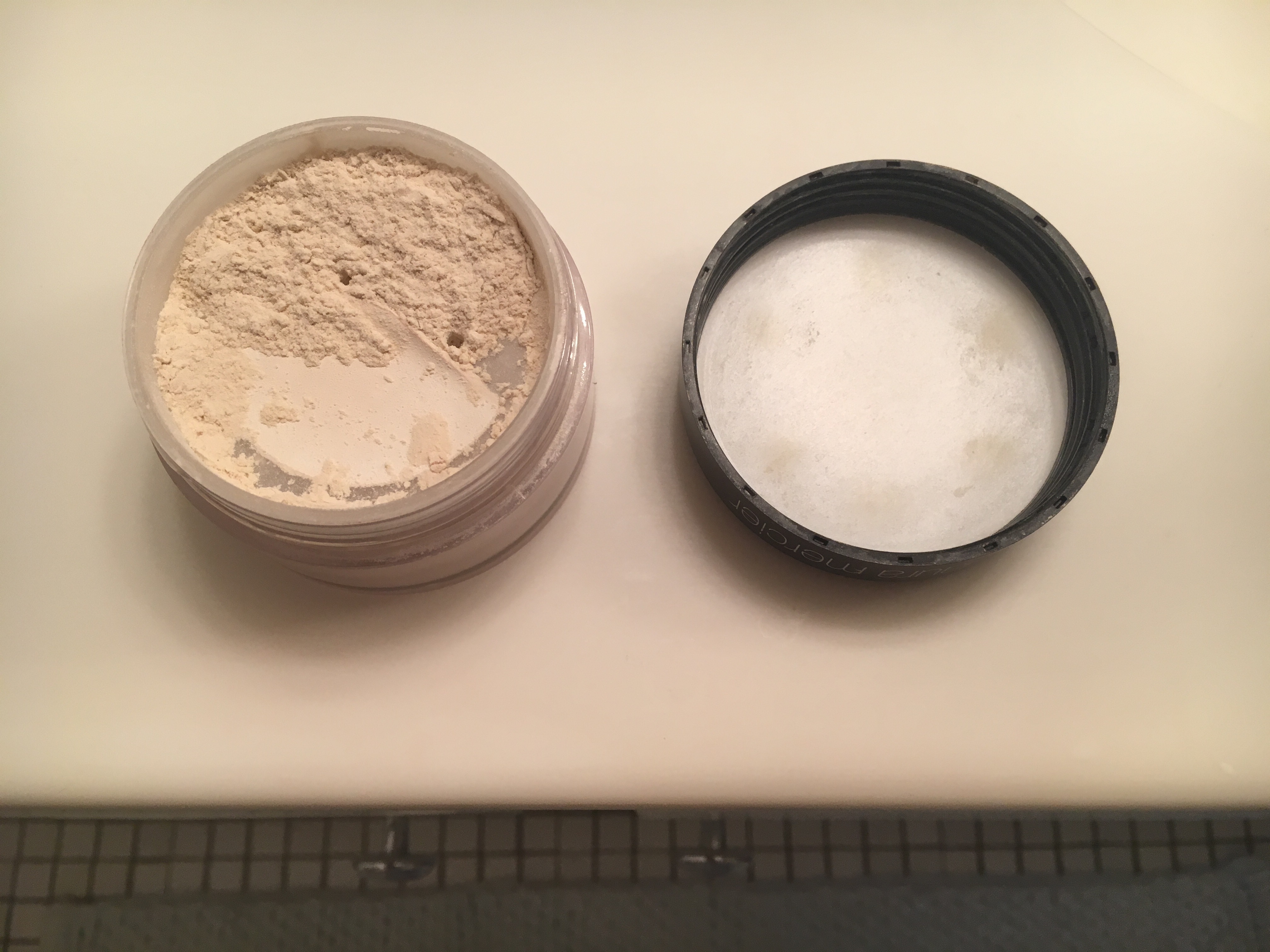 Pro tip: pull back part of the paper cover to expose half as many holes. This will prevent the powder from overflowing into the top half of the container when you travel.