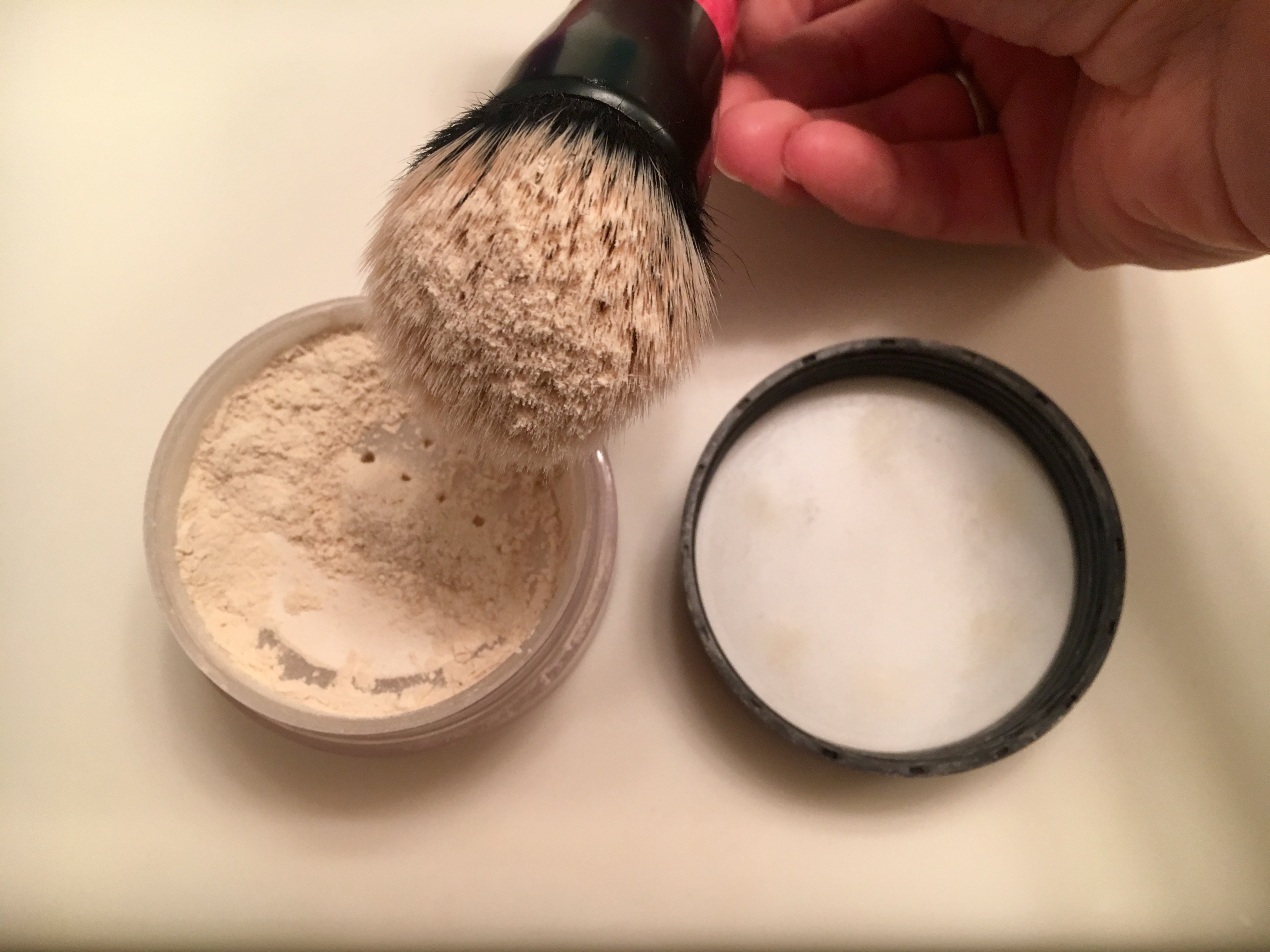 A little goes a long way. I tapped this brush a few times before applying.