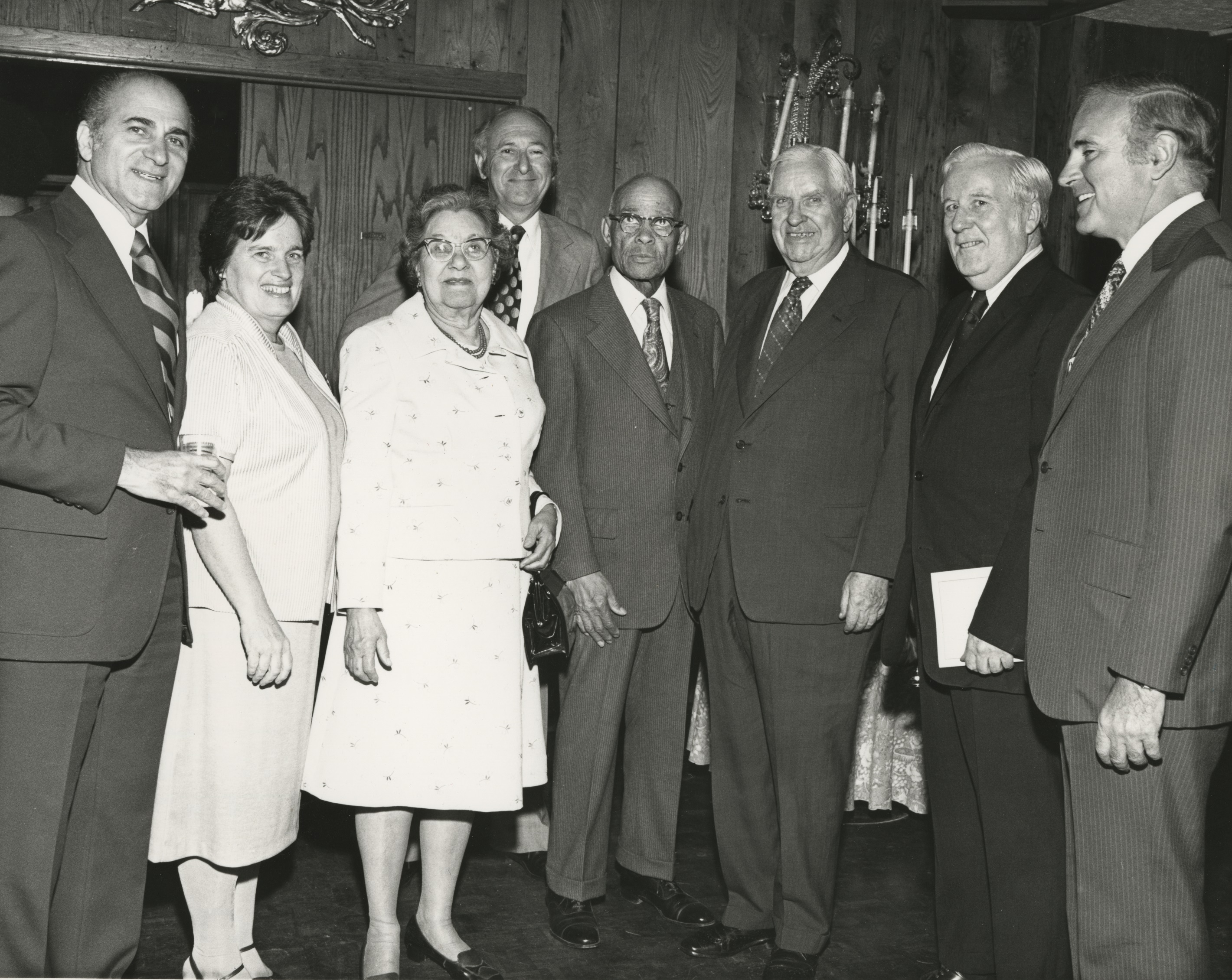 Marshak stands with a number of others at a Physics conference.