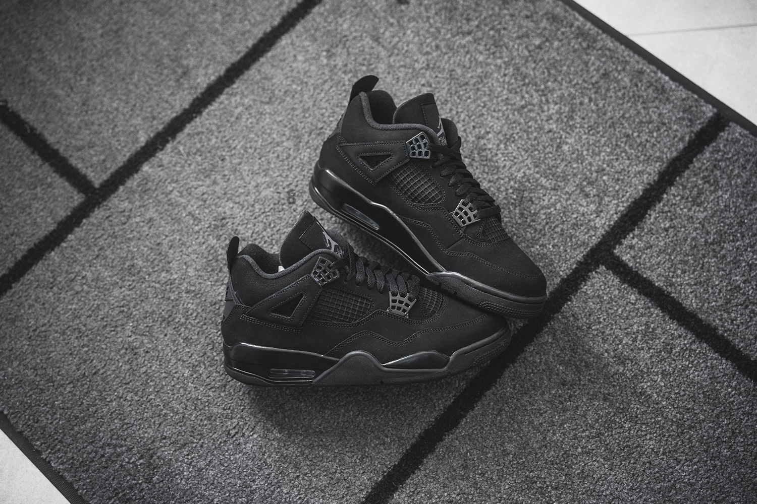 jordan 4 black cats on feet