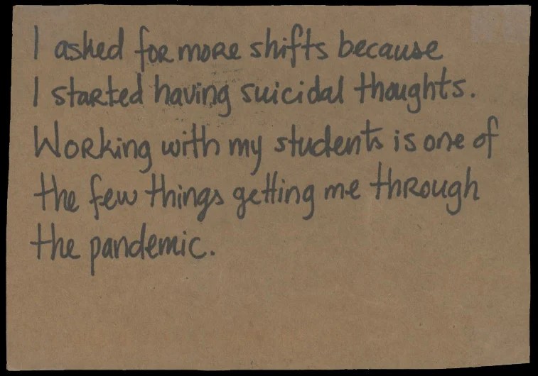 Handwritten text on a brown background.