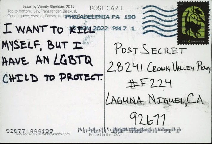 A handwritten message on a postcard expressing deep emotional conflict.