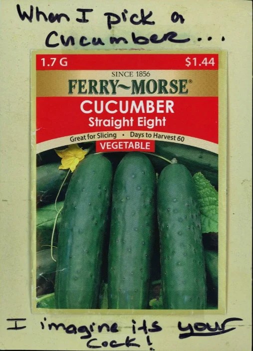 A seed packet featuring cucumbers with handwritten text above and below.
