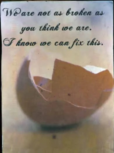 An image of a cracked eggshell with a soft, warm background.