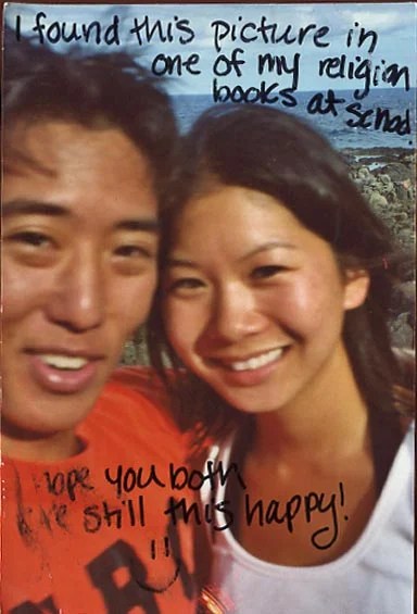 A close-up photo of two smiling individuals against a scenic background.