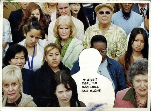 A crowded scene with a highlighted figure expressing feelings of invisibility.
