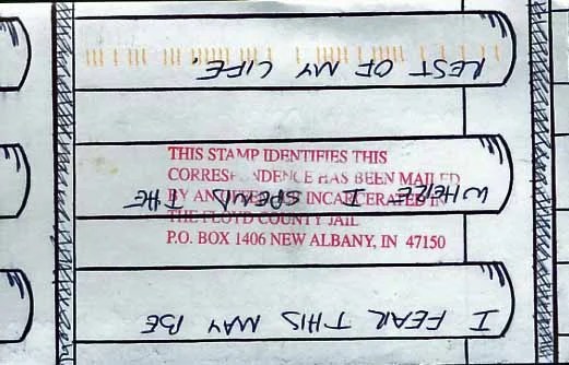 A handwritten note with a stamp indicating it was mailed from jail.