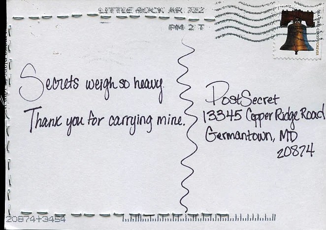 A simple postcard with handwritten text expressing feelings about secrets.