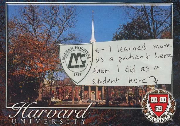 A scenic view of Harvard University with autumn trees and a church steeple.