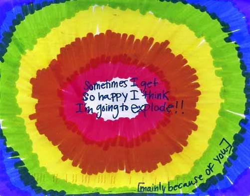 A vibrant, circular design with concentric colors radiating outward.
