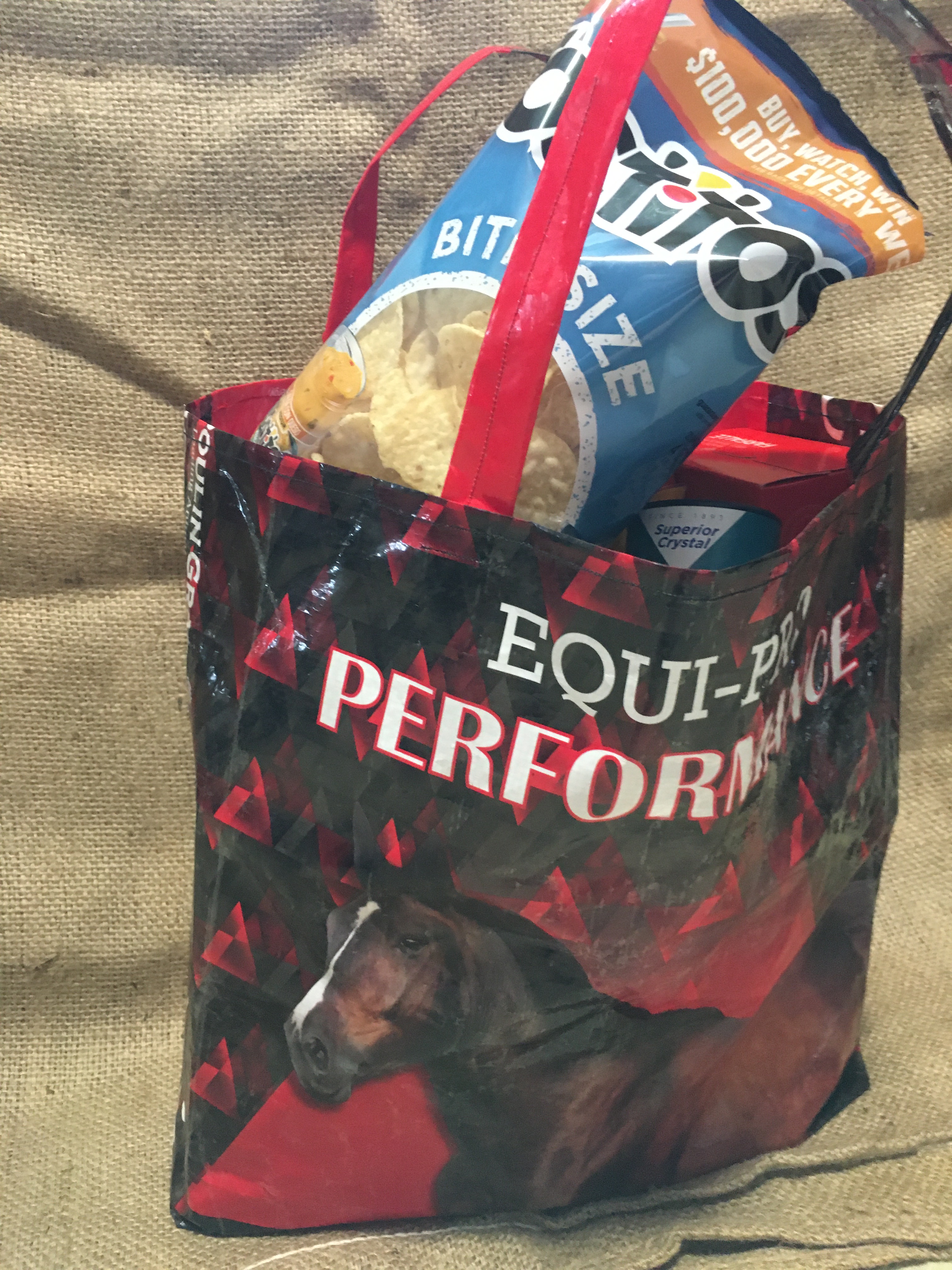 red and black horse shpping tote filled with groceries