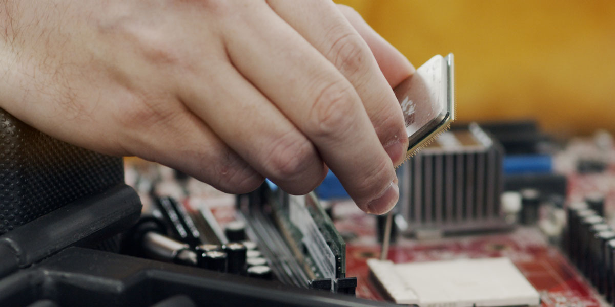 A person disassembling a computer