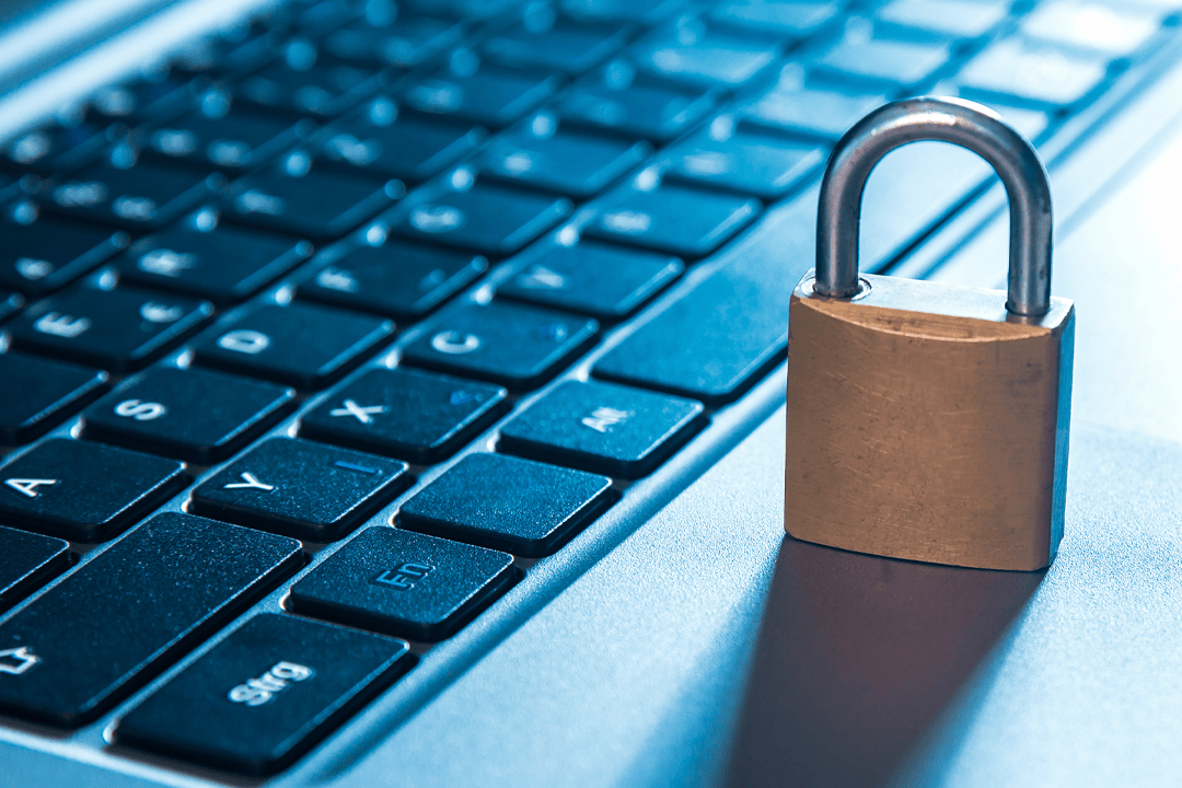 Padlock resting on a laptop keyboard, symbolizing website security.