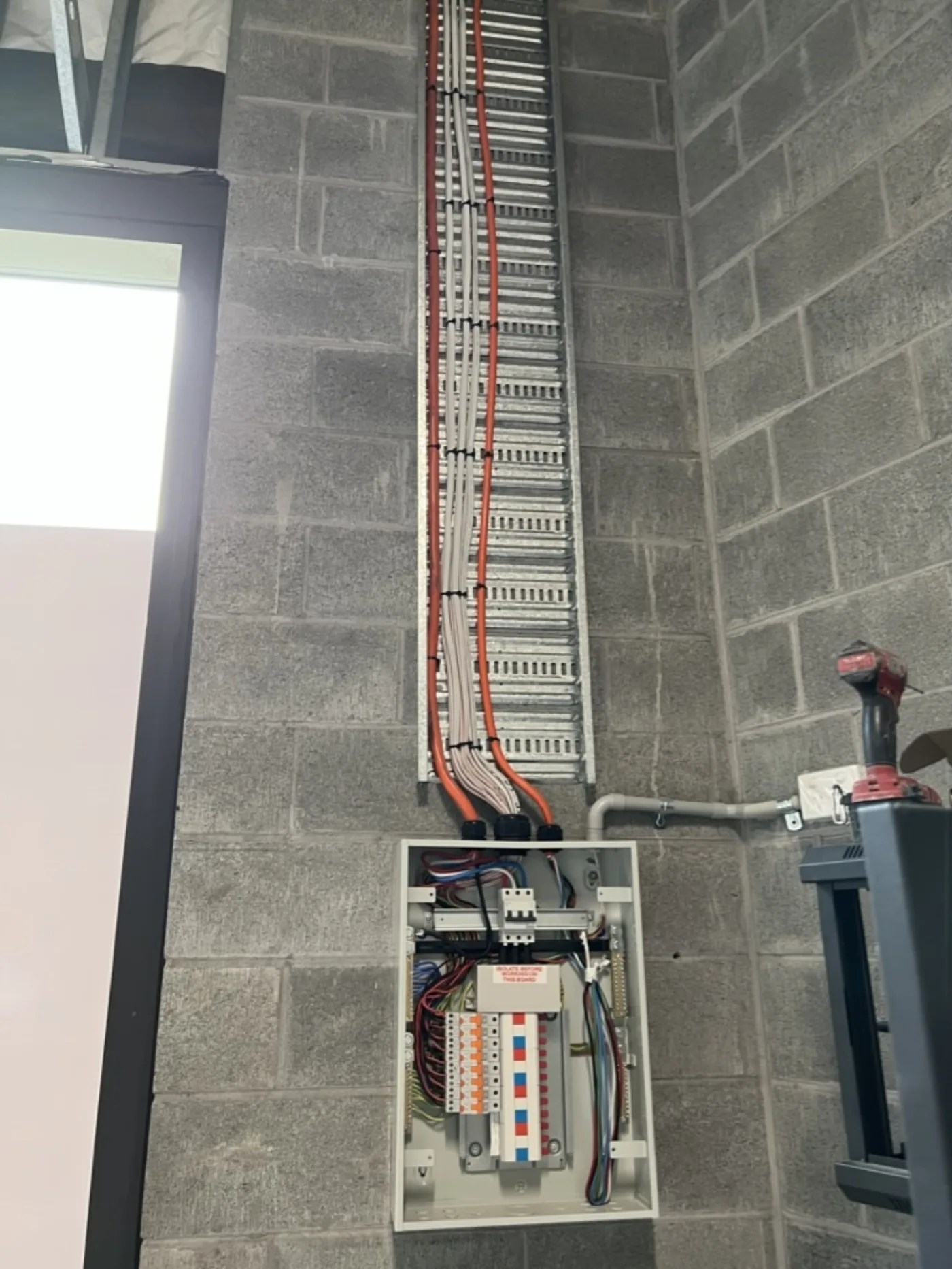 Vertical cable riser and sub-board installed by SRS Services in a Sydney commercial building