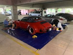 Michael putting the final touches on the Speedster in the Concours preparation area