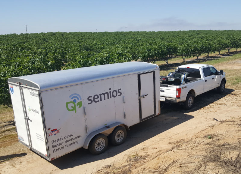 A Semios field services crew vehicle arriving at a customer site for servicing.