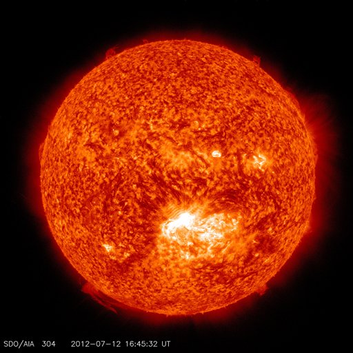 This image captured in the 304 Angstrom wavelength, which is typically colorized in red provided by NASA shows a solar flare, lower center, erupting from the sun on Thursday, July 12, 2012. Space weather scientists said there should be little impact to Earth. The flare erupted from a region which rotated into view on July 6, 2012. (AP Photo/NASA)