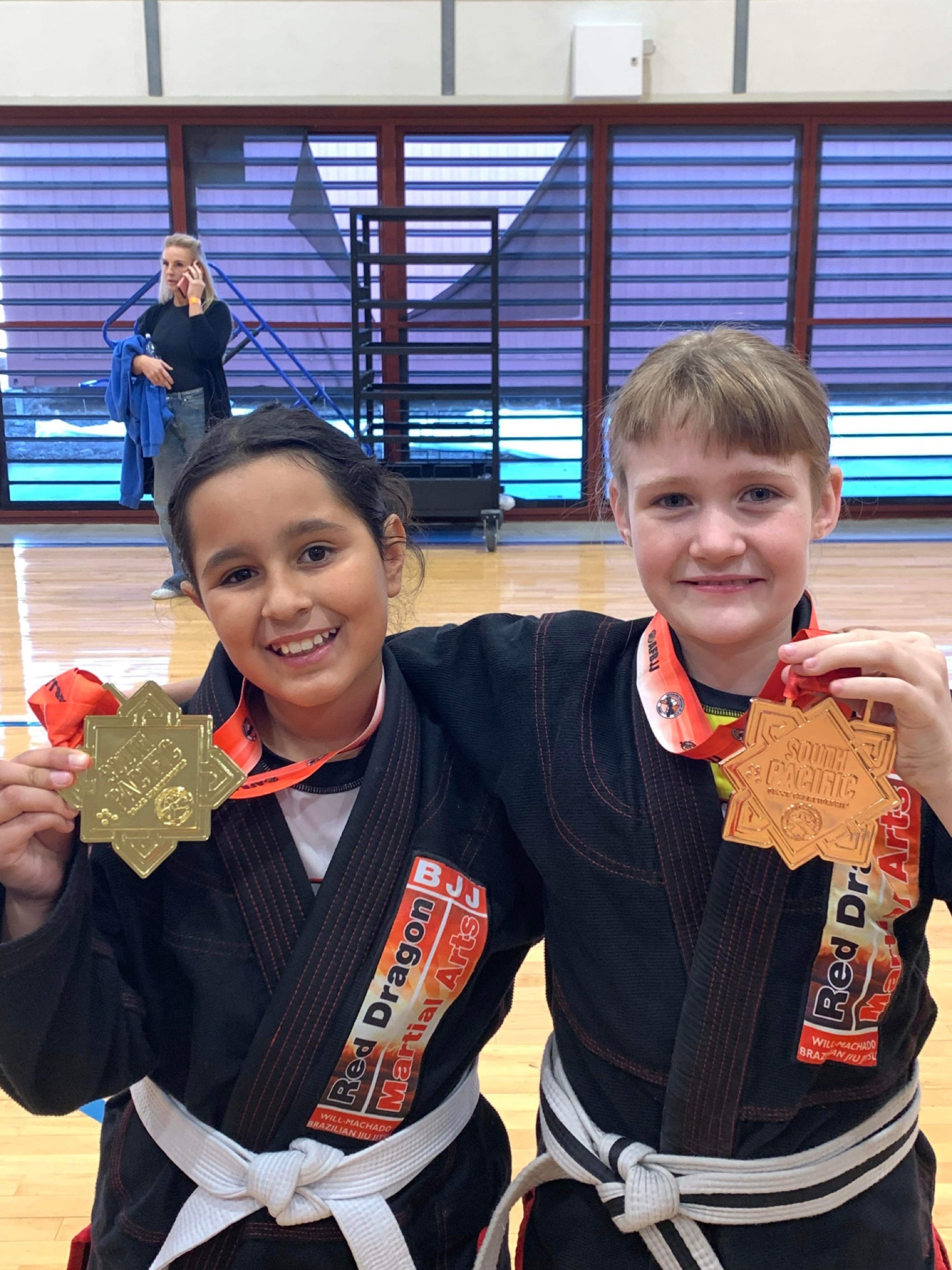 Red Dragon pair achieves medals