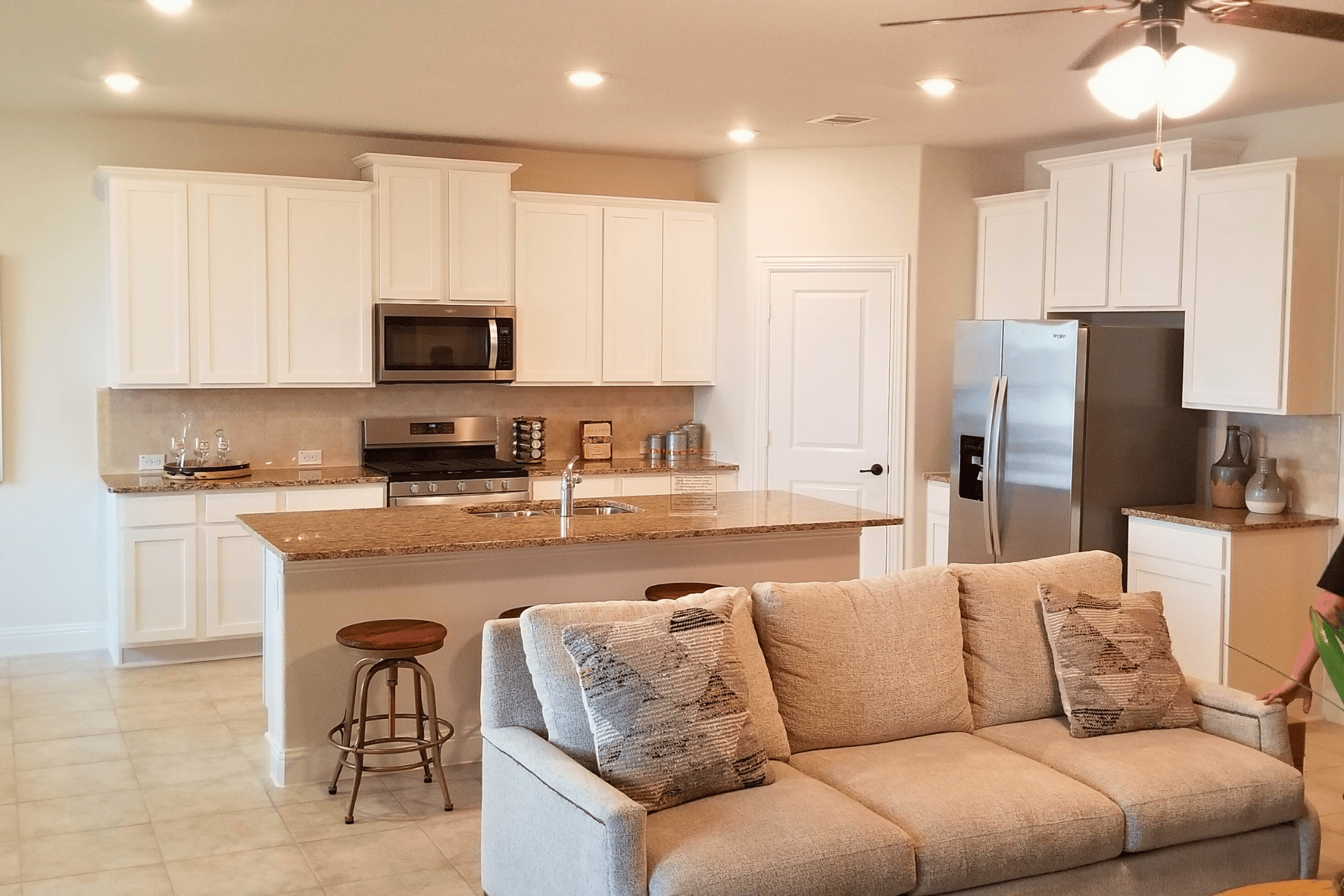 Kitchen with an island sink and faucet