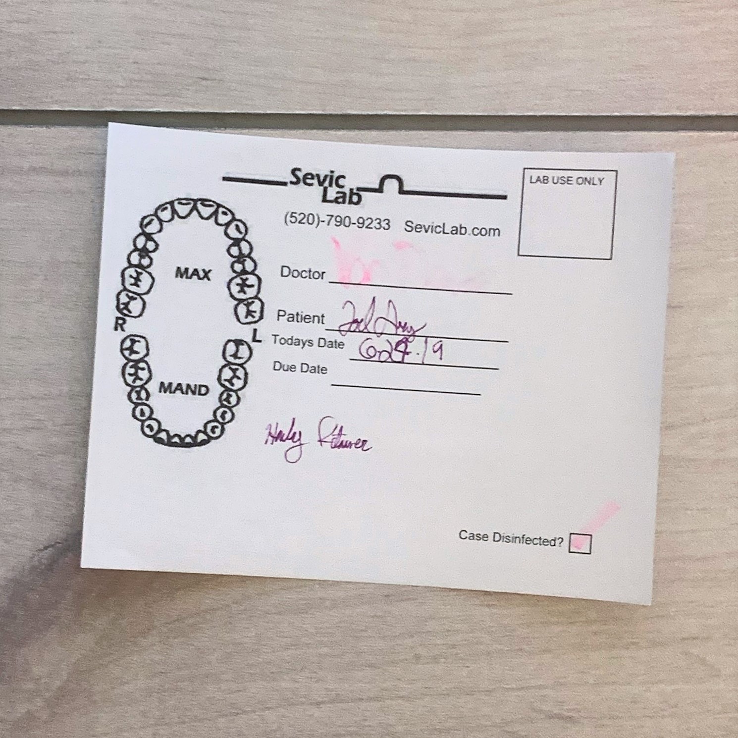 Poorly colored pen and fancy, illegible writing.