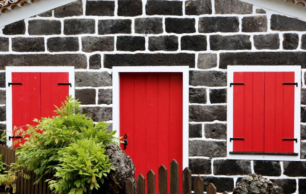 Red door symbolizing the courage to face insecurity and answer God's call