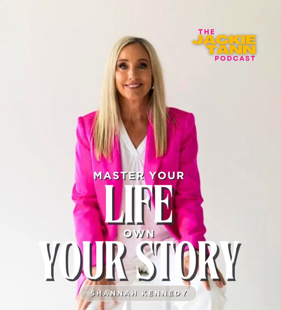 Shannah Kennedy in a pink blazer, smiling and looking at the camera making an appearance on the Jackie Tann Podcast.