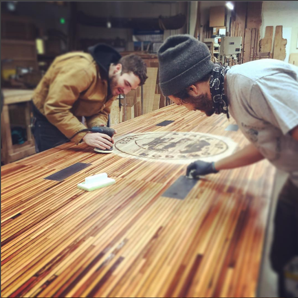 The awesome ADX Fab team finishing a table for the Oregon Dept. of Energy.