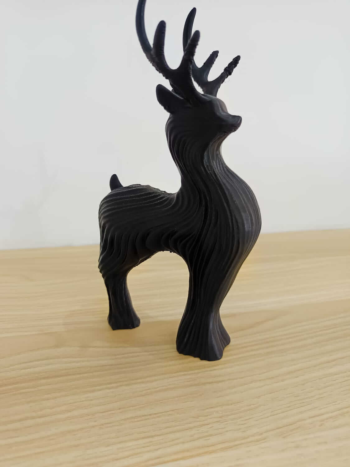 An image of black reindeer collectible