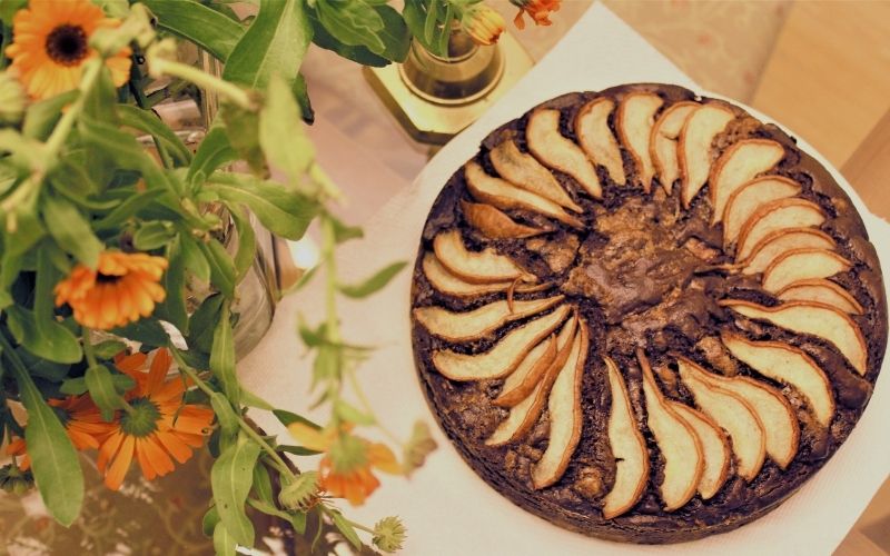 Chocolate Pear Torte with orange flowers on the side