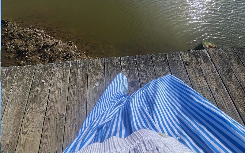 Blue and white sundress on a dock
