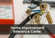Close-up photograph of home improvement and electrical testing tools, including a multimeter, wiring, and metal connection terminals. A gray banner across the lower portion of the image displays the text “Home Improvement Reference Center.”
