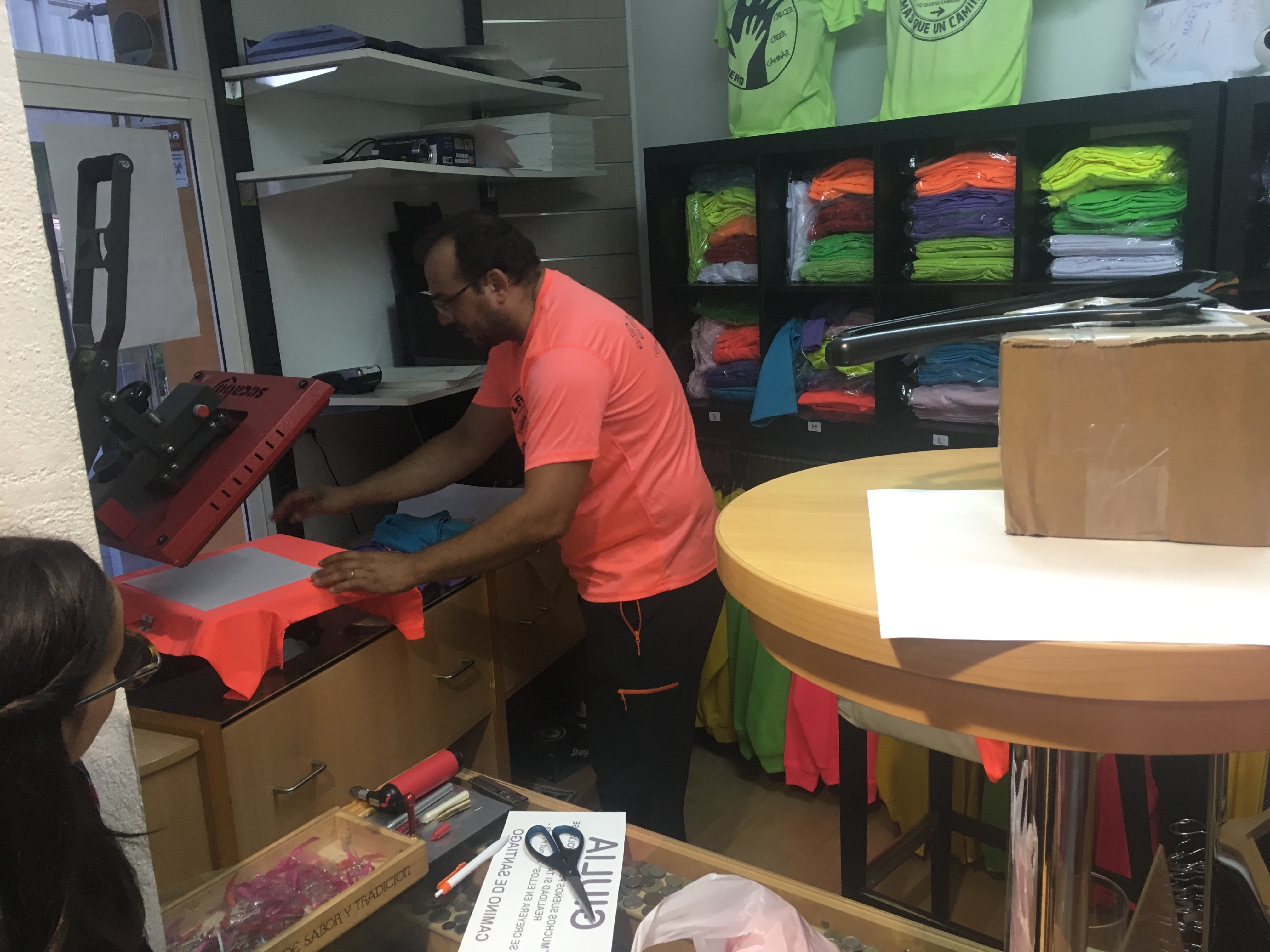 Ionut Prena busily screen printing shirts until all hours!