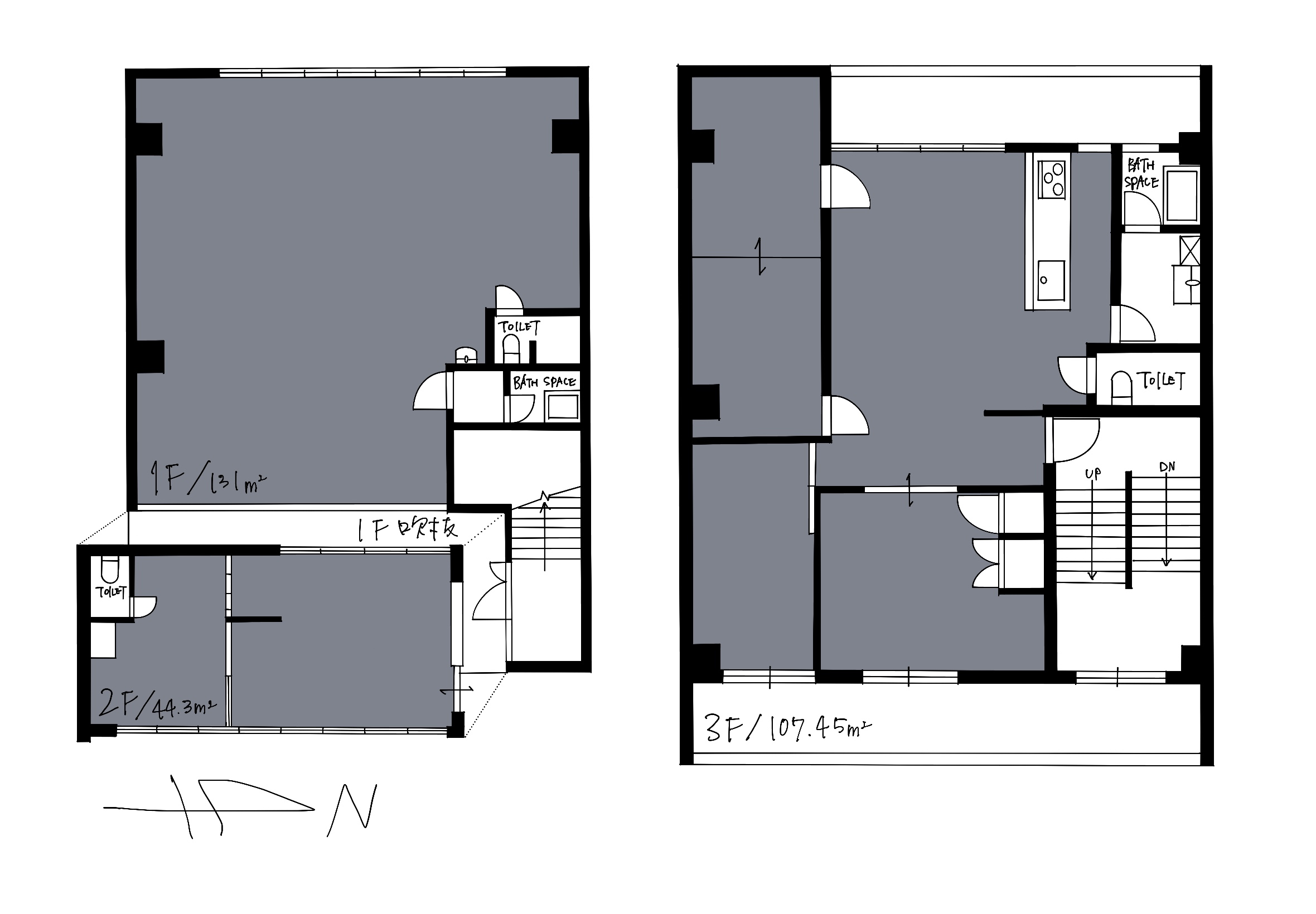 Three-level architectural floor plan showing rooms, corridors, stairs, and labeled toilets and bath spaces with an orientation arrow (N).