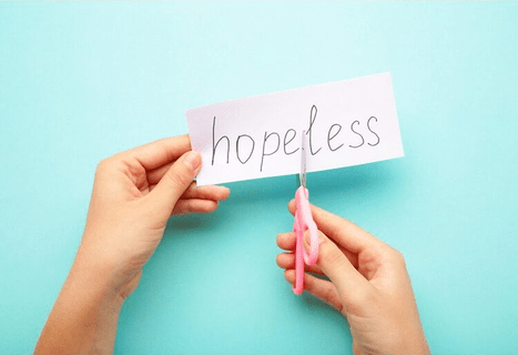 Image of woman cutting "less" from "hopeless" suggest trusting God and finding hope in seasons of hopelesseness